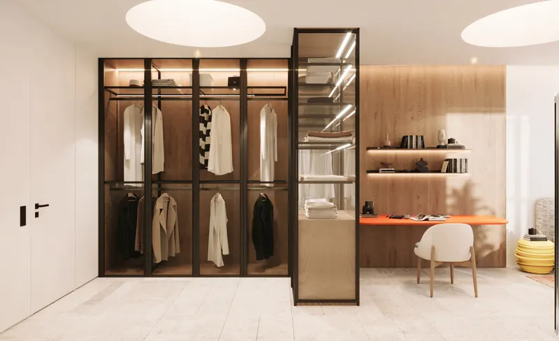 Ovoo Bodrum residence dressing room with glazed metal-framed wardrobes and timber shelving