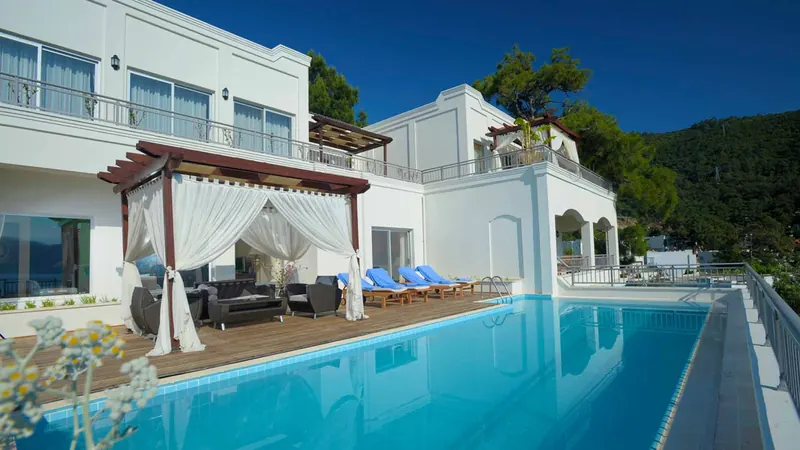 Rixos Premium Bodrum, pool terrace and white villa buildings above the Aegean