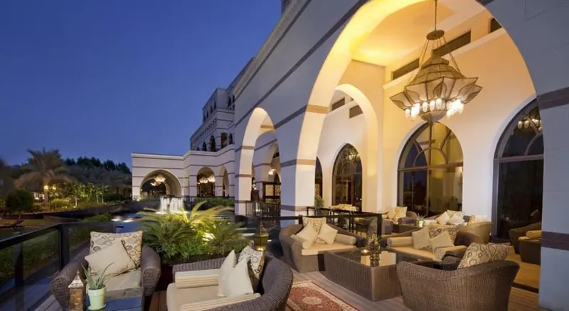 Jumeirah Zabeel Saray, Dubai: arched terrace lounge with outdoor seating at dusk